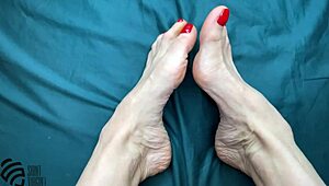 Footfetish with a new red pedicure