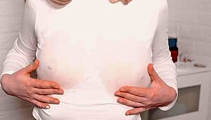 a young beauty with juicy breasts teases her wet nipples. she works her hairy pussy to climax.