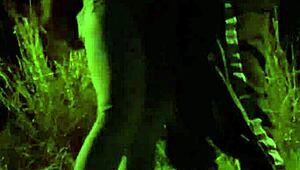 Teens engage in mutual masturbation and blowjob in outdoor field with watchers.