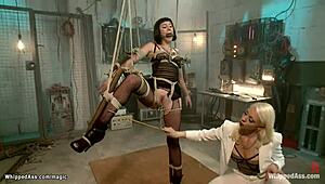 bound lesbian slut gets caned and banged hard, ouch!