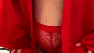 Watch this brunette tease in red lingerie?