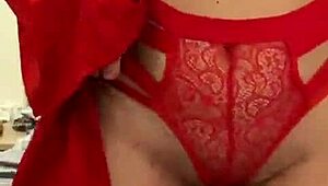 Watch this brunette tease in red lingerie?