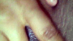 Black girl works her pussy with intense fingering