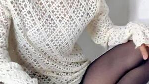 Siganjue tidies up in front of the mirror before work