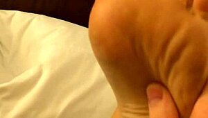 wb coworker with high arches rubbing feet casually