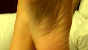 wb coworker with high arches rubbing feet casually