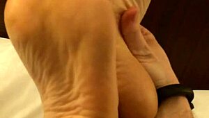 wb coworker with high arches rubbing feet casually