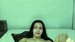 Babe sits on huge dildo with tattoo