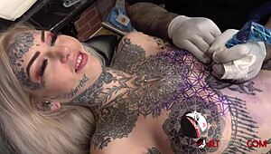 Sascha toys with Amber Luke during her wild tattoo session