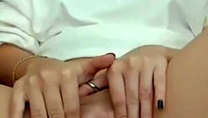 The hot brunette feels excited showing her wet pussy on webcam during masturbation.