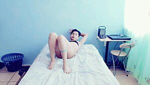 A young hot gay man masturbates passionately in his bedroom.