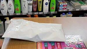 Asian Ladyboy Teases with Fresh Thong Display in Local Convenience Store Setting.