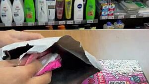 Asian Ladyboy Teases with Fresh Thong Display in Local Convenience Store Setting.