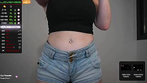 Sexy webcam girl, so cute, playing with a big dildo nearby