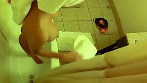 brett rossi lathers up her curvy blonde body in a steamy shower scene