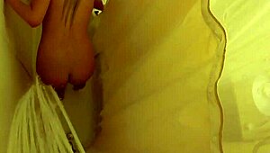 brett rossi lathers up her curvy blonde body in a steamy shower scene