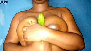 Ebony Woman Caresses Her Voluptuous Breasts