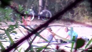 Spanner can see us - German milf Lou in beach threesome