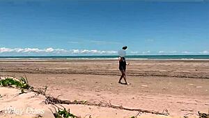 Watch my wife play football nude on the public clothed beach? She's flashing her big tits!