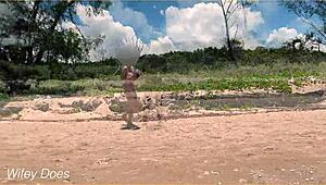 Watch my wife play football nude on the public clothed beach? She's flashing her big tits!