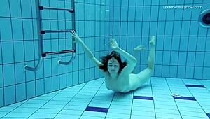 Yo, check Lada Poleshuk showing off big tits underwater with that short hair vibe!