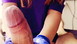 in a quiet room, a redhead works a huge cock with gloved hands, ending in a cum-covered mess.