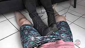 Resting her boots on my cock and balls