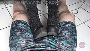 Resting her boots on my cock and balls