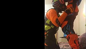 gay motocross rider gives blowjob in costume fetish.