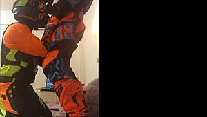 gay motocross rider gives blowjob in costume fetish.