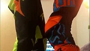 gay motocross rider gives blowjob in costume fetish.
