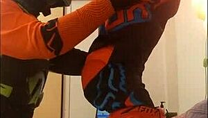 gay motocross rider gives blowjob in costume fetish.