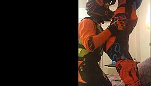 gay motocross rider gives blowjob in costume fetish.