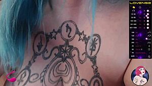 Webcam model interacts with swollen areas and juicy features on camera.