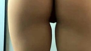 Curly-haired guy dancing funk with ass focus