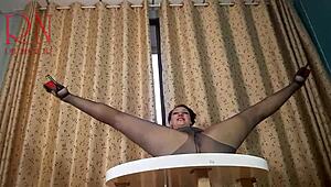 hey, check this curvy brunette strip in heels at the table