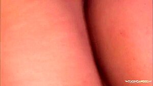 while licking her feet seductively, the brunette wants a foot cumshot