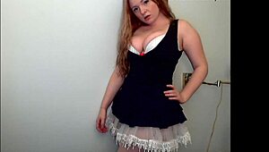 Hey, check this redheaded slut stripping down, teasing with every move, total fuck doll vibe