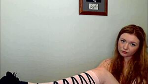 Hey, check this redheaded slut stripping down, teasing with every move, total fuck doll vibe
