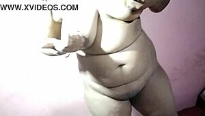 Desi hot Indian babe strips her dress slowly. She teases with big natural tits.