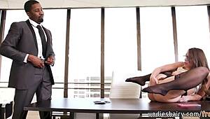 Slutty office girl rubs her pussy before sucking her boss's monster black dick. Isiah Maxwell and Gia Derza heat up the office.