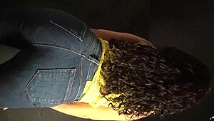 Moving her butt and hips to the music in a sexy outfit with long nails