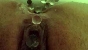 whore squirts while pushing small eggs in bdsm play