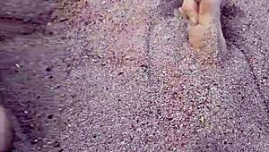 Barefoot Beauty Teases in Natural Sand Setting