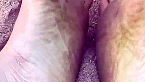 Barefoot Beauty Teases in Natural Sand Setting