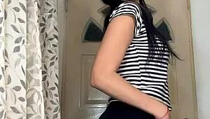 a latina girl rips her clothes off in a steamy striptease solo