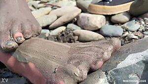 Goddess flaunts filthy nylon feet in torn pantyhose by river