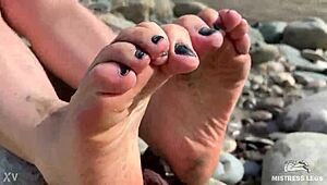 Goddess flaunts filthy nylon feet in torn pantyhose by river