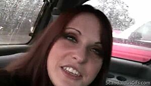 a redhead teen relaxes in the car outdoors