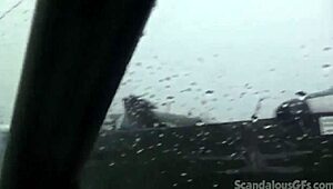 a redhead teen relaxes in the car outdoors